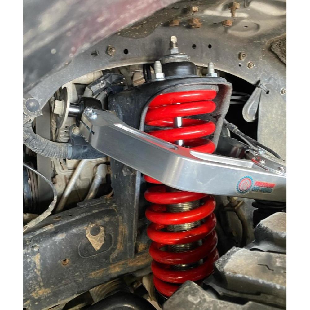 Freedom Off-Road Billet Front Upper Control Arms for Toyota 4Runner, FJ Cruiser, Lexus GX460 & GX470 with red coil spring and adjustable suspension