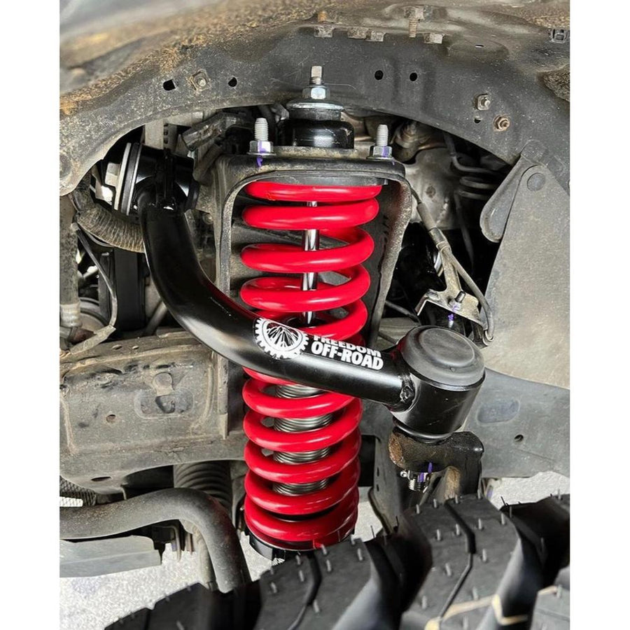 Freedom Off-Road Front Upper Control Arms for Toyota 4Runner, FJ Cruiser, Lexus GX460 & GX470 heavy-duty tubular steel arm with red coil spring suspension