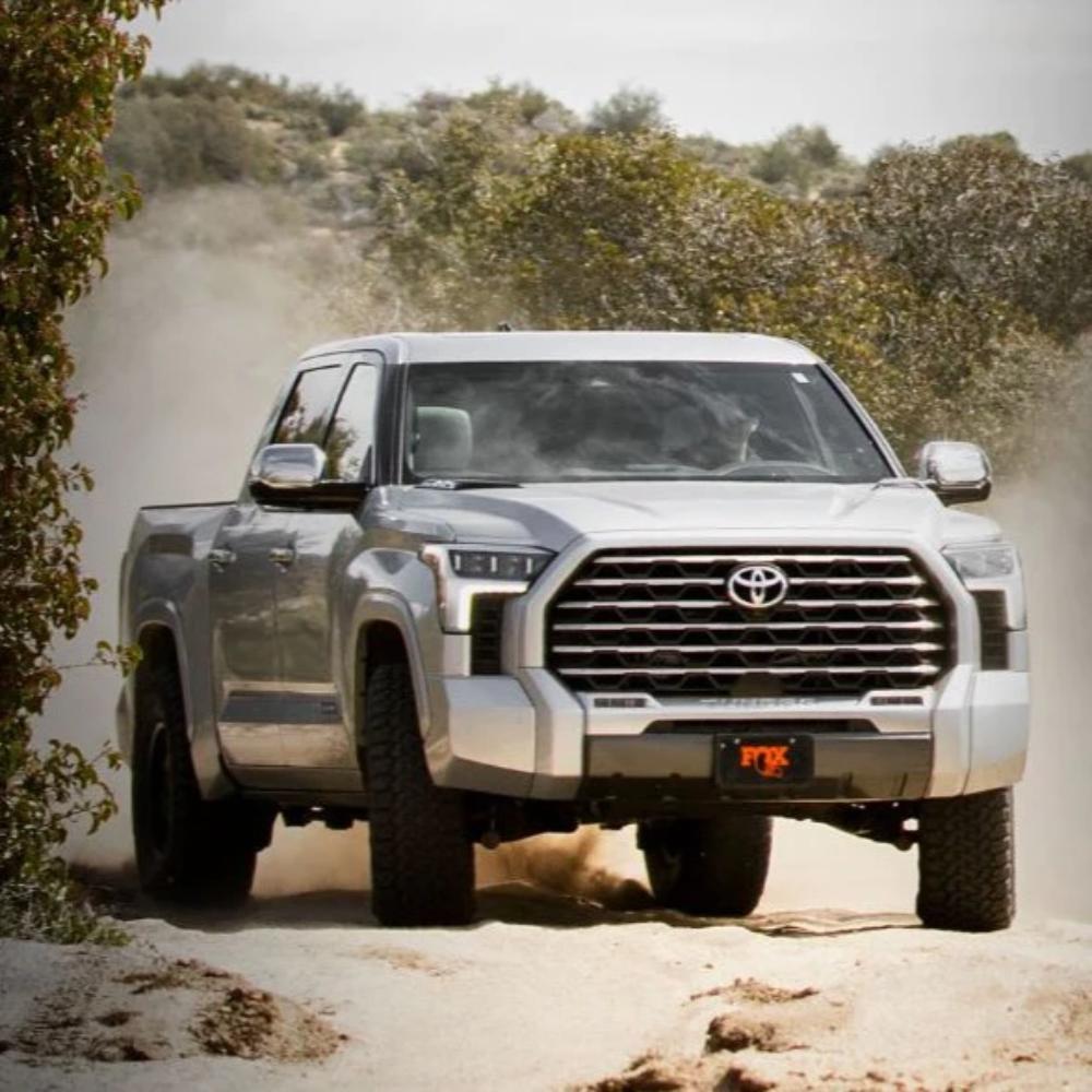 Lifted 2022 Toyota Tundra equipped with FOX 2.5 Factory Race 2-2.25" Leveling Kit for Tundra (22-ON) off-road suspension