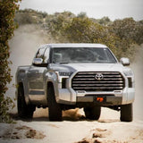 Lifted 2022 Toyota Tundra equipped with FOX 2.5 Factory Race 2-2.25" Leveling Kit for Tundra (22-ON) off-road suspension