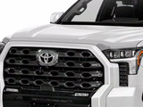AVS 22-23 Chevrolet Silverado 1500 Low Profile Acrylic Hood Shield - Chrome installed on front hood edge of white truck