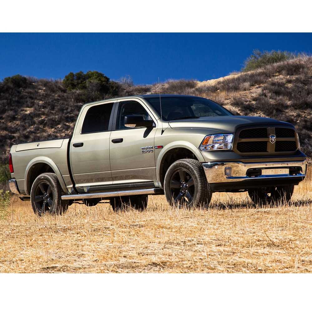 KING 1.5 - 2 inch Leveling Kit for RAM 1500 (09-18) installed on beige 2009-2018 Dodge RAM 1500 with rugged off-road tires