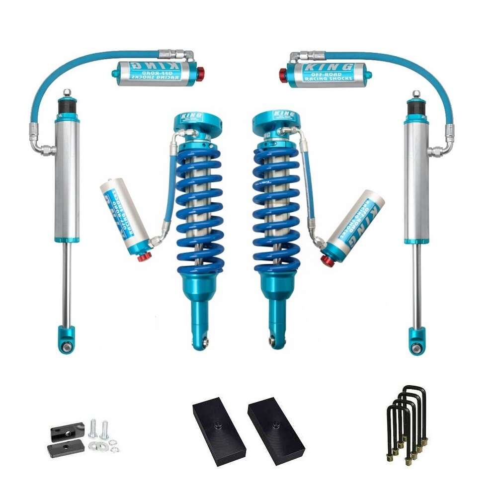 A set of King Shocks and springs for enhanced off-road performance and stability on a Toyota Tacoma, featuring the KING 2 - 3 inch Lift Kit for Tacoma (05-23) from King Shocks.