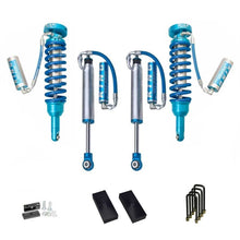 Load image into Gallery viewer, A set of King Shocks 2 - 3 inch Lift Kit for Tacoma (05-23), offering enhanced stability and off-road performance.