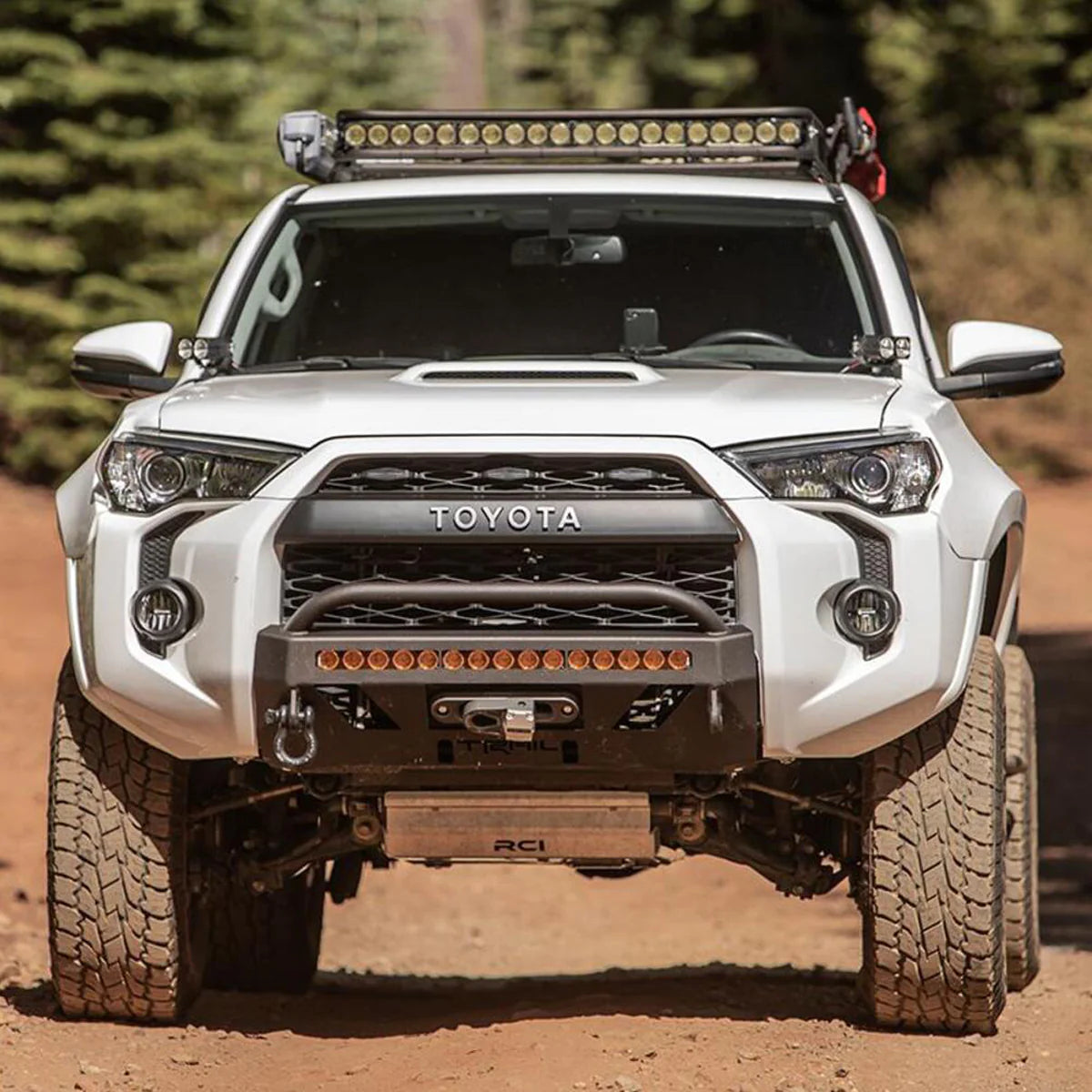 Test Variations No App front view on lifted 5th Gen Toyota 4Runner with rugged off-road tires and roof light bar by Mudify