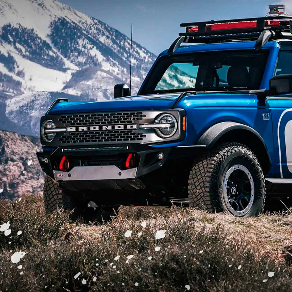 The 2020 Ford Bronco, with its Old Man Emu OME 3 inch Lift Kit for Bronco Black Diamond, Badlands (21-ON) suspension system and Nitrocharger shocks, is parked in the mountains, offering an enhanced ride quality.