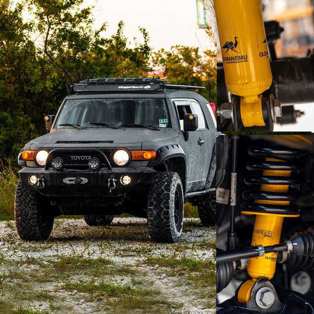 A Toyota FJ Cruiser with the Old Man Emu OME 2 inch Lift Kit for FJ Cruiser (10-ON) - Front Shocks Assembly and enhanced ground clearance.
