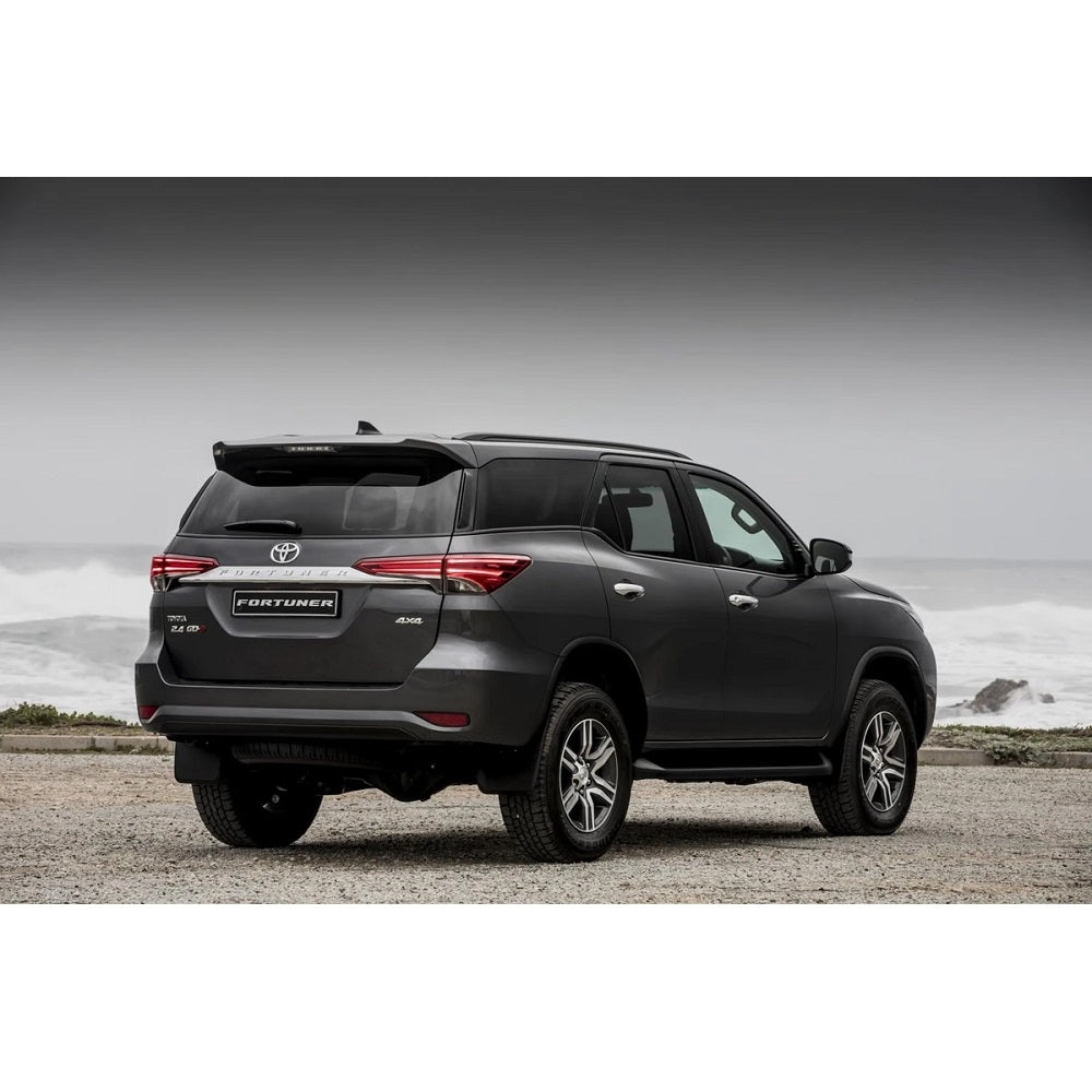 The back end of a gray Toyota Fortuner showcases its impressive ground clearance and reliable suspension system with the OME 2 inch Lift Kit for Fortuner (15-ON) by Old Man Emu.