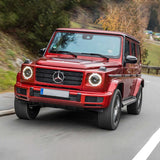 Old Man Emu OME Nitro+ 2 - 2.5 inch Lift Kit for Mercedes G-Wagon (1990 - 2018 Solid Axle Models) on road in red SUV