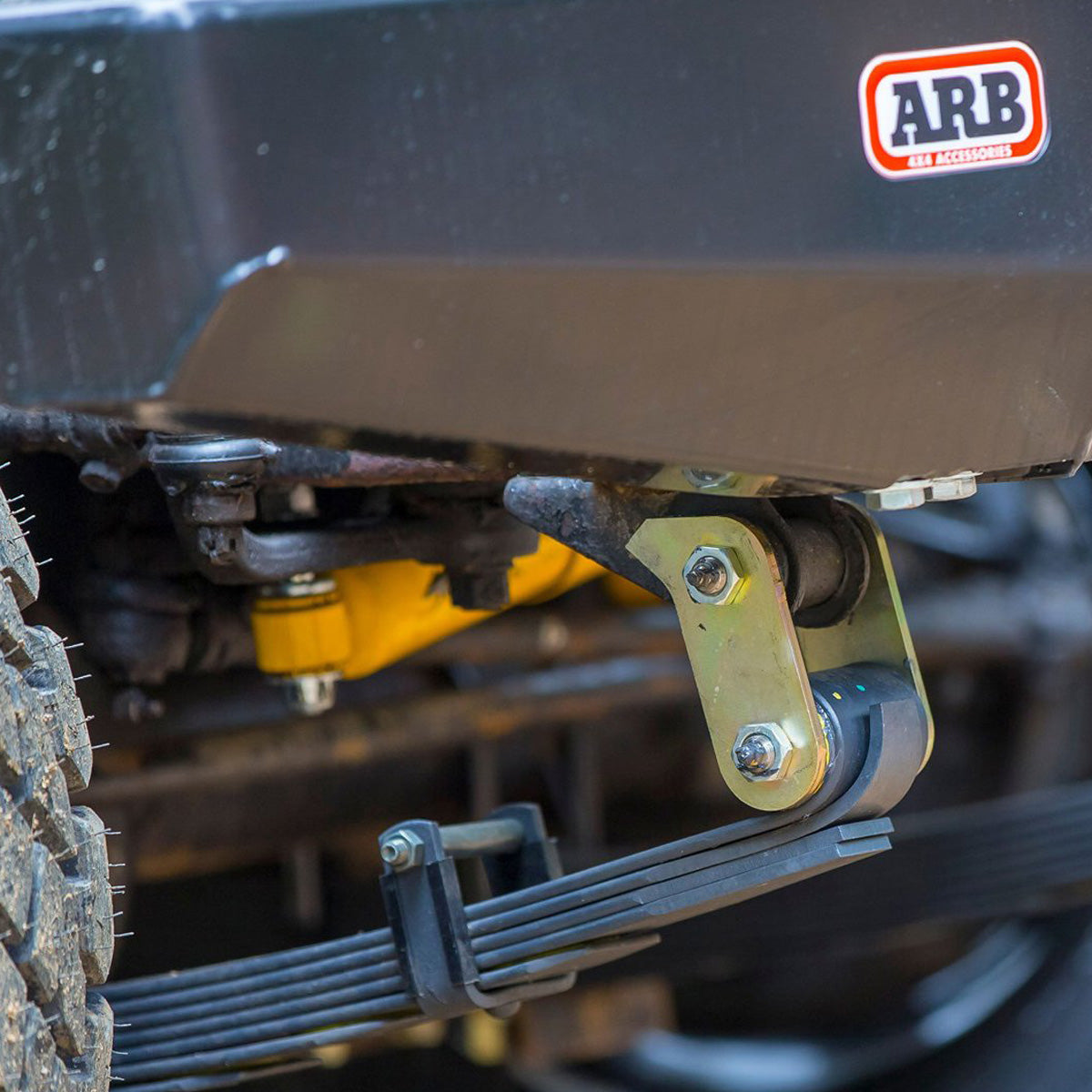 A close up of a Old Man Emu vehicle with the OME 2.5 - 3 inch Essentials Lift Kit for Hilux Revo, Rocco, SR5 (15-22) and a rear bumper.