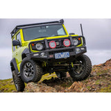 OME Nitro+ 2.5 inch Lift Kit for Suzuki Jimny (18-ON) on lifted off-road vehicle with rugged tires and heavy-duty suspension components