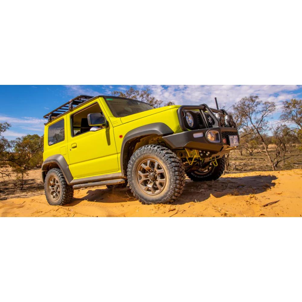 OME Nitro+ 2.5 inch Lift Kit for Suzuki Jimny (18-ON) on lifted yellow Suzuki with off-road tires and suspension components