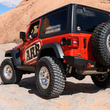 The Jeep Wrangler is equipped with the Old Man Emu OME 2 inch Lift Kit for Jeep Wrangler JL 2 Door (18-23) suspension system and Nitrocharger shocks, providing increased ground clearance.