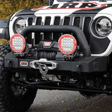 Load image into Gallery viewer, The front end of a Old Man Emu Jeep Wrangler JL 4 Door (18-23) with a light bar and enhanced ground clearance.