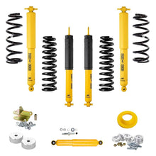 Load image into Gallery viewer, A yellow OME 2 inch Lift Kit for Wrangler LJ / TJ Unlimited (03-06) with Old Man Emu suspension system and Nitrocharger shocks for increased ground clearance.
