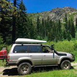 Toyota Land Cruiser with the Old Man Emu 4 inch Lift Kit for Lexus LX450 (96-97) suspension system and roof rack.