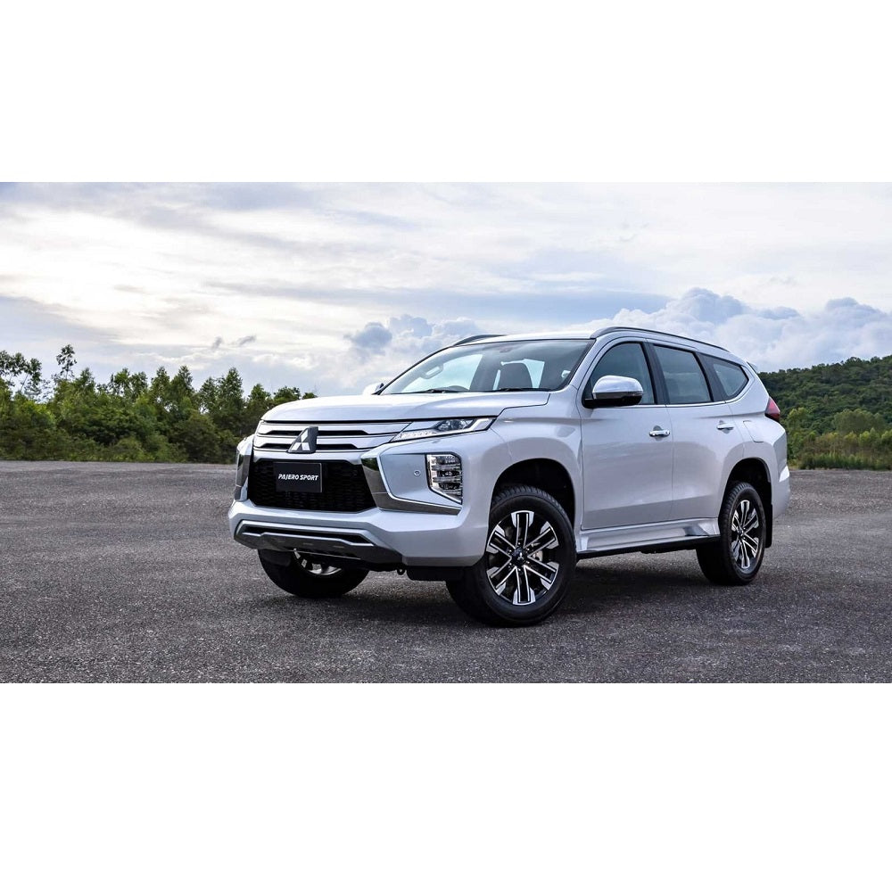 The 2019 Mitsubishi Montero, equipped with the Old Man Emu OME 2 inch Lift Kit for Montero Sport (15-21) and Nitrocharger shocks, is parked in a parking lot.
