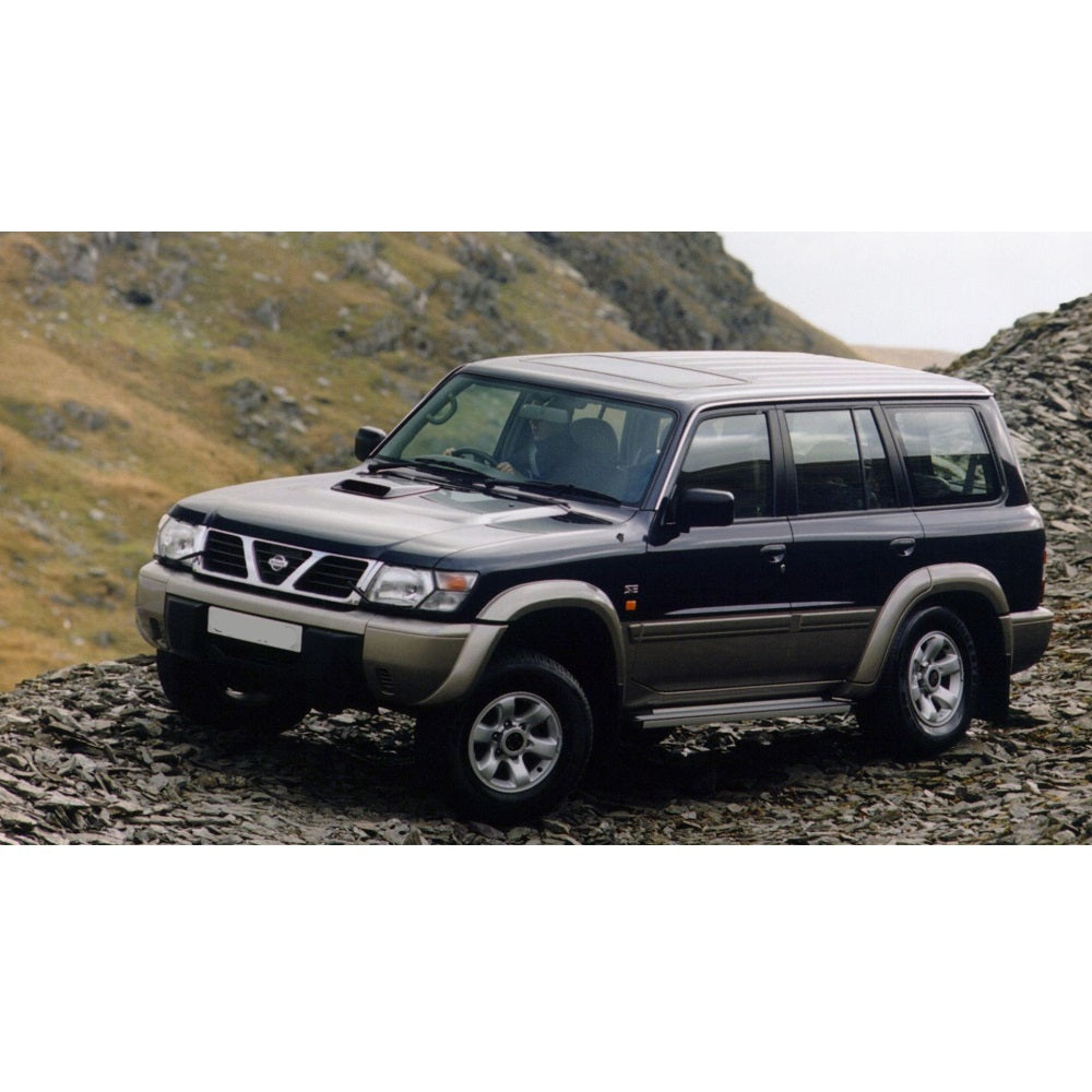 An OME 2 inch Lift Kit for Patrol Y61 (99-09)-equipped Nissan Patrol parked on a rocky hillside, showcasing its impressive ground clearance and rugged Old Man Emu suspension system.