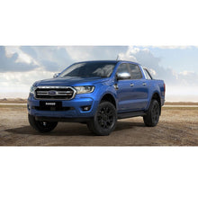Load image into Gallery viewer, A blue Ford Ranger parked on a dirt road with an Old Man Emu OME 2 inch Lift Kit for Ranger PX3 (18-ON) providing increased ground clearance.