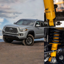 Load image into Gallery viewer, Upgrade your 2019 Toyota Tacoma suspension system with the superior performance of Old Man Emu shocks and springs, specifically the OME 2.5 inch Essentials Lift Kit for Tacoma (16-23) - Front Shocks Assembly. Enhance ground clearance and optimize off-road capabilities for an unmatched driving experience.