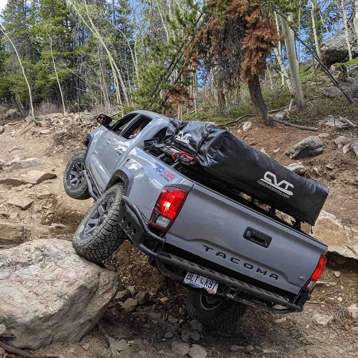 OME Nitro+ 2 inch Leveling Kit for Tacoma RWD (16-23) with Assembled Front Shocks shown on rugged off-road terrain