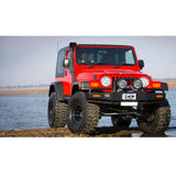 Old Man Emu Nitro+ 2 inch Lift Kit for Wrangler TJ 2 Door (97-06) on lifted red Jeep with off-road tires