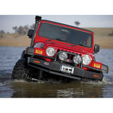 Old Man Emu Nitro+ 2 inch Lift Kit for Wrangler TJ 2 Door (97-06) with lifted suspension and off-road tires in water crossing