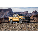 KING 2-3 inch Leveling Kit for Ranger (19-ON US Model) installed on yellow Ford Ranger off-road terrain background