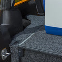 The ARB Roller Drawer Side Floor Kit RD945FK back seat of a jeep has a cooler module installed in it.
