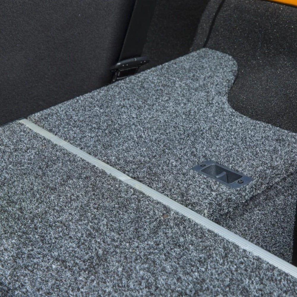 An ARB Roller Drawer Side Floor Kit RD945FK vehicle specific back seat with a grey carpet.