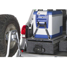 Load image into Gallery viewer, The back of an ARB water-resistant SUV with an ARB Outback Solutions Roller Drawer &amp; Roller Floor RDRF945 attached to it for off-road driving enthusiasts.