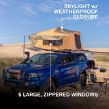 ARB Flinders Rooftop Tent 803300A mounted on blue off-road truck with skylight, weatherproof closure, and zippered windows