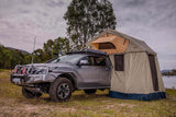 Mudify Simpson III Rooftop Tent with Annex 803804 mounted on lifted gray off-road 4x4 truck at campsite
