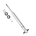 Heavy-duty monotube shock absorber with mounting hardware, bushings, washers, and nuts on a white background