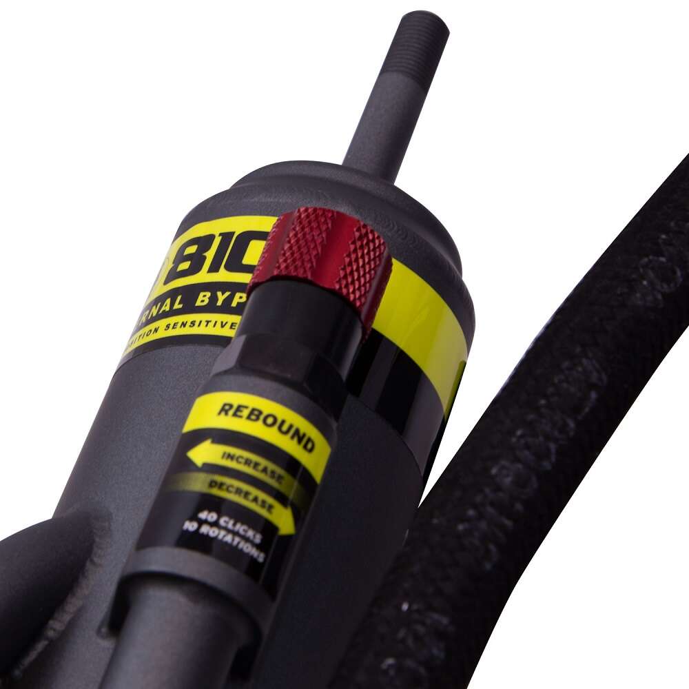 A black and yellow Bilstein B8 8100 Bypass Rear Left Shock Absorber bil25-320442 hose with a yellow nozzle for Toyota Tacoma 05-23.