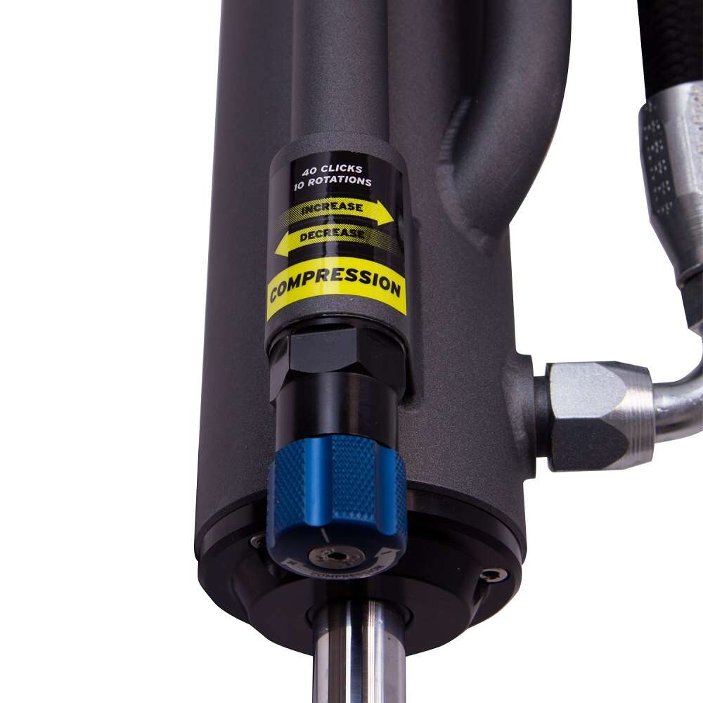 A Bilstein B8 8100 Bypass Rear Left Shock Absorber bil25-320442 for Toyota Tacoma 05-23 hydraulic cylinder with shock absorbers attached to it.