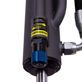 A Bilstein B8 8100 Bypass Rear Left Shock Absorber bil25-320442 for Toyota Tacoma 05-23 hydraulic cylinder with shock absorbers attached to it.
