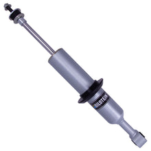 Load image into Gallery viewer, A Bilstein B8 6112 Series Front Shock bil47-311039 for Toyota 4Runner 10-23, Lexus GX460 10-23, FJ Cruiser 10-14 shock absorber for a car on a white background, providing enhanced ground clearance.