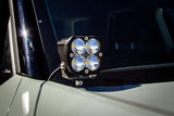 Baja Designs 21+ Ford Bronco Sport Squadron Pro Spot LED Light Pods - Clear mounted on vehicle hood bracket with wiring harness