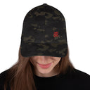 Mudify FlexFit Cap with elastic stretch band, structured six-panel design, and curved visor in dark camouflage pattern