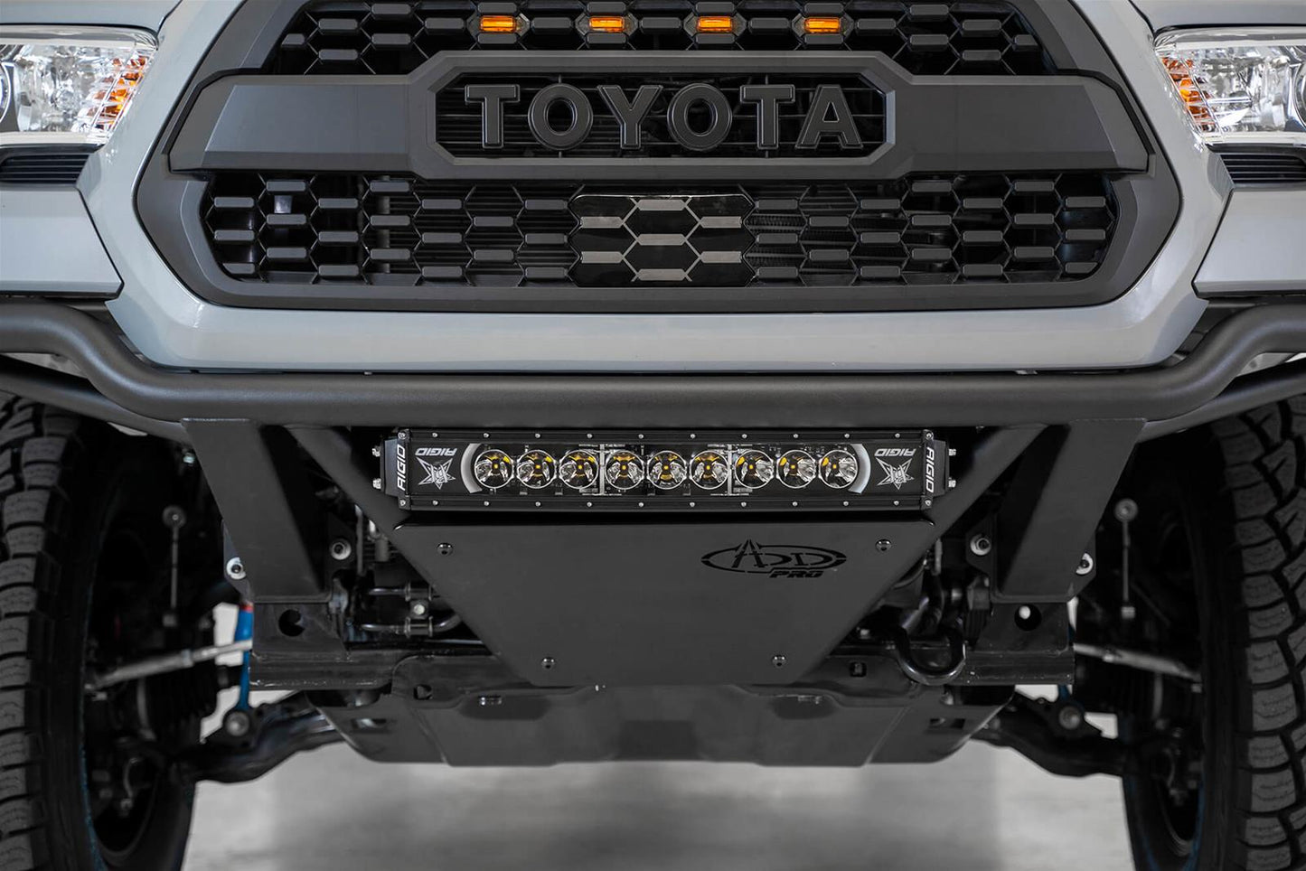 ADD Offroad Stealth Bumpers F688102100103 for Toyota Tacoma 2016-2023 with integrated LED light bar and sensor cutouts by Addictive Desert Designs