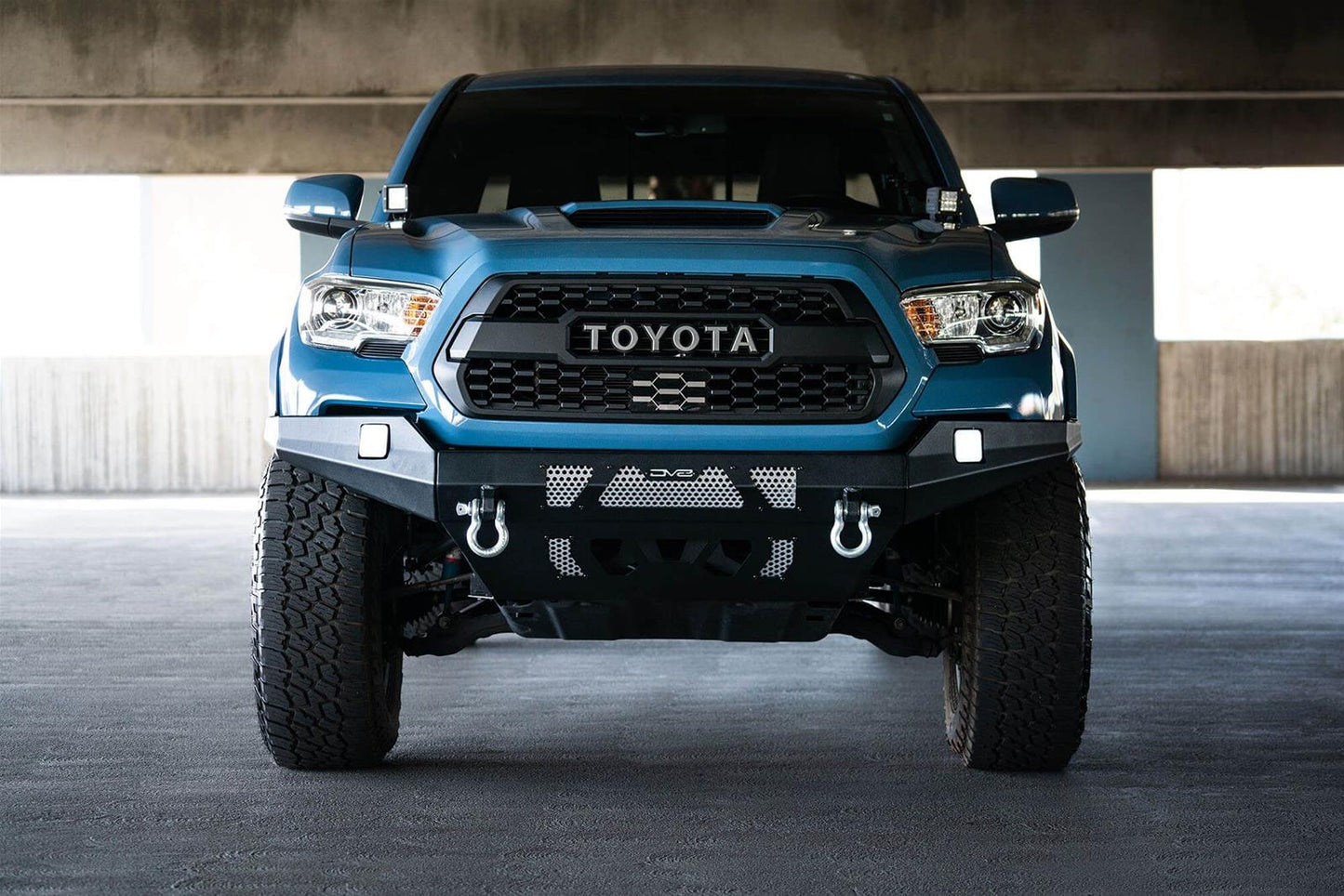 DV8 Offroad Bumpers FBTT1-04 for Toyota Tacoma 2016-2023 low-profile steel bumper with clevis mounts and mesh light bar panel