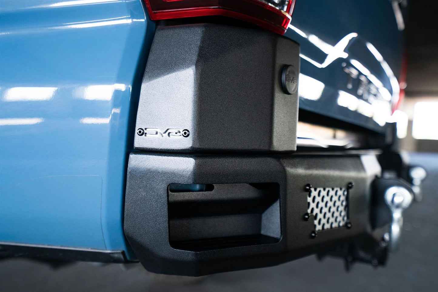 DV8 Offroad MTO Series Rear Bumper RBTT1-04 for Toyota Tacoma 2016-2023 with integrated side steps and aluminum mesh panels