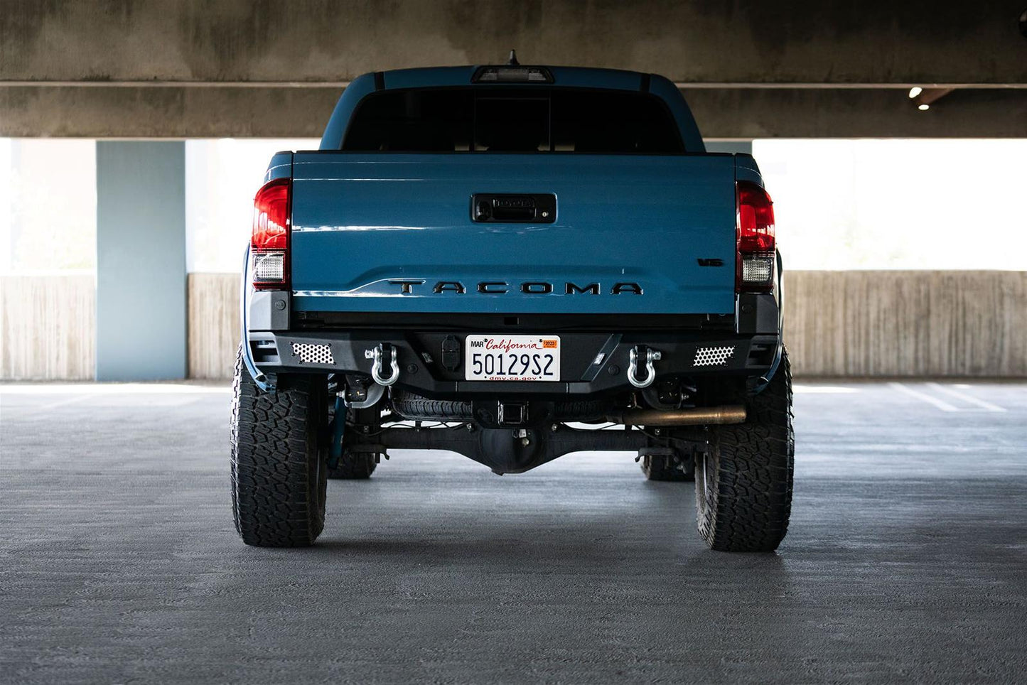 DV8 Offroad MTO Series Rear Bumper RBTT1-04 for Toyota Tacoma 2016-2023 with integrated side steps and aluminum mesh light mounts