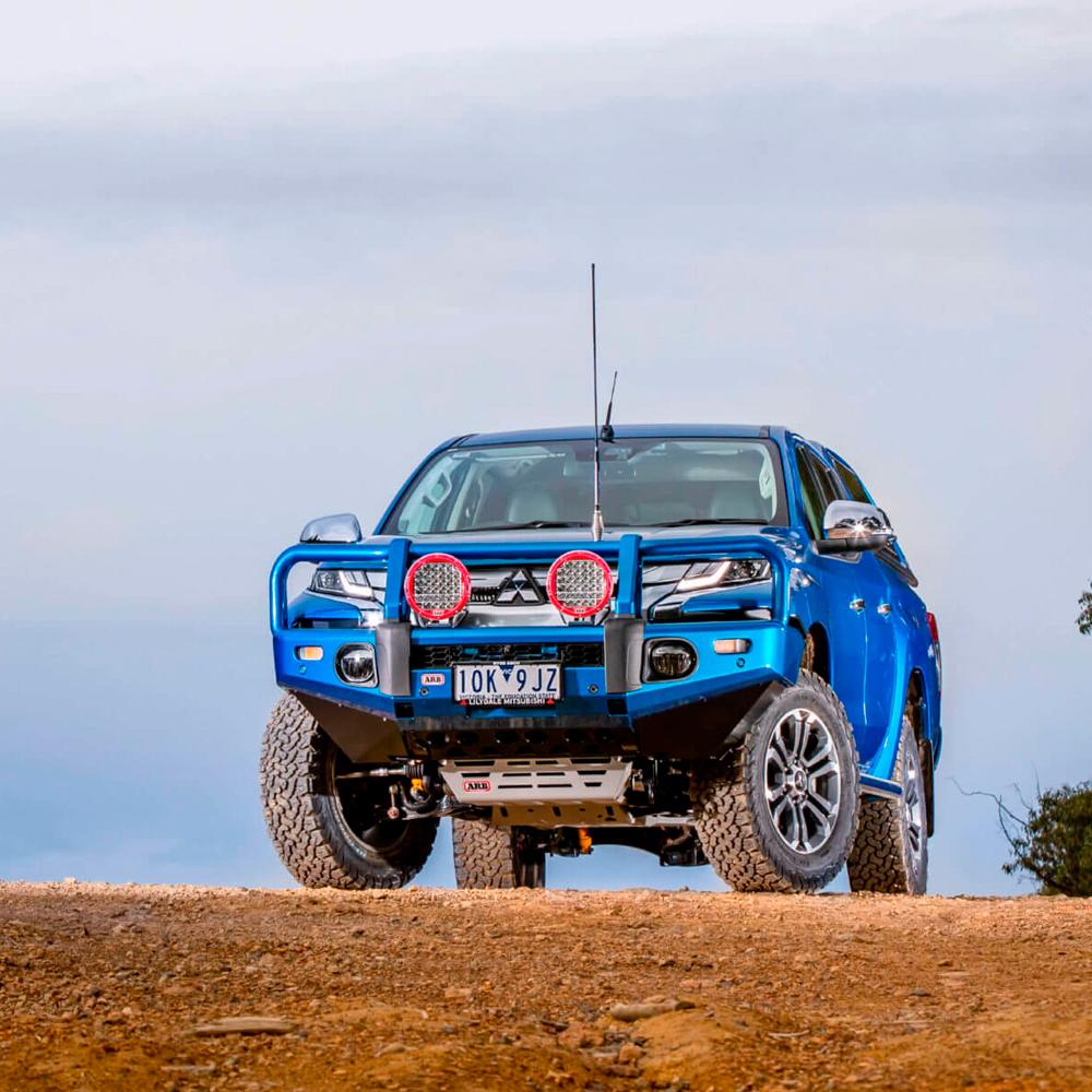 ARB Old Man Emu Front Nitrocharger Plus Strut 93010 for Toyota 4Runner, Tacoma, FJ Cruiser, LandCruiser 100 Series (IFS) Not AHC Models installed on blue off-road truck