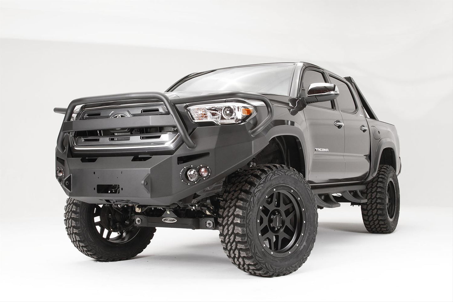 Fab Fours Premium Winch Full Guard Bumper TT16-B3650-1 for Toyota Tacoma 2005-2023 with heavy-duty winch mount and adjustable fit