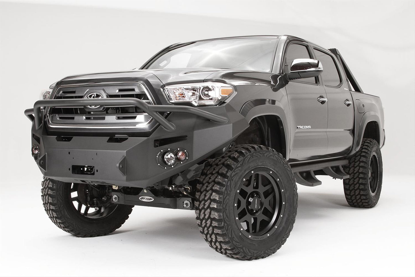 Fab Fours Premium Winch Pre-Runner Bumper TT16-B3652-1 for Toyota Tacoma 2005-2023 with heavy-duty winch mount and adjustable fit