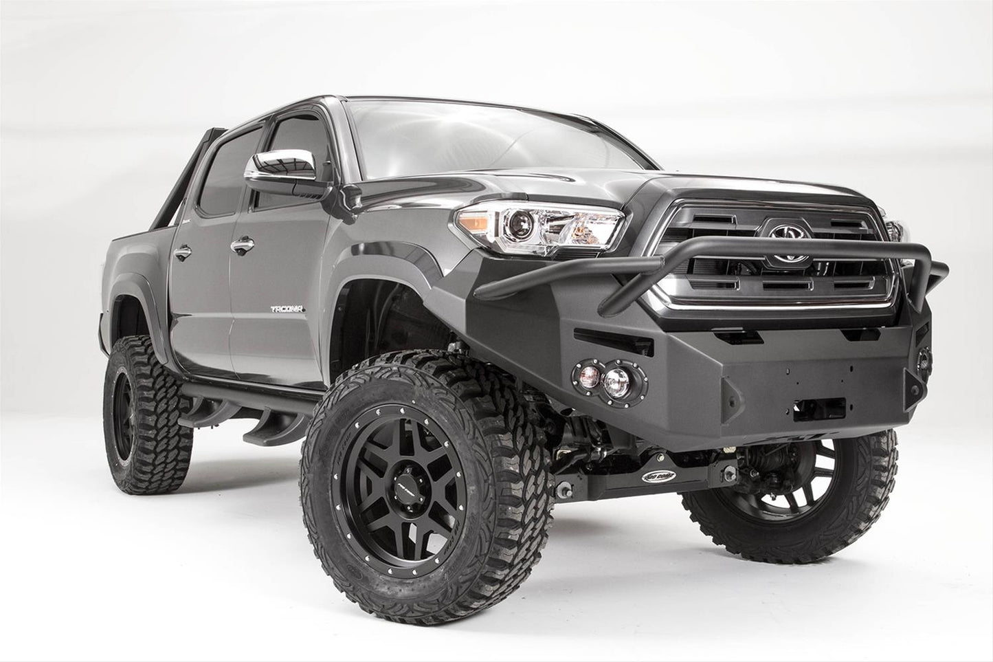 Fab Fours Premium Winch Pre-Runner Bumper TT16-B3652-1 for Toyota Tacoma 2005-2023 with heavy-duty adjustable winch mount and D-ring tabs