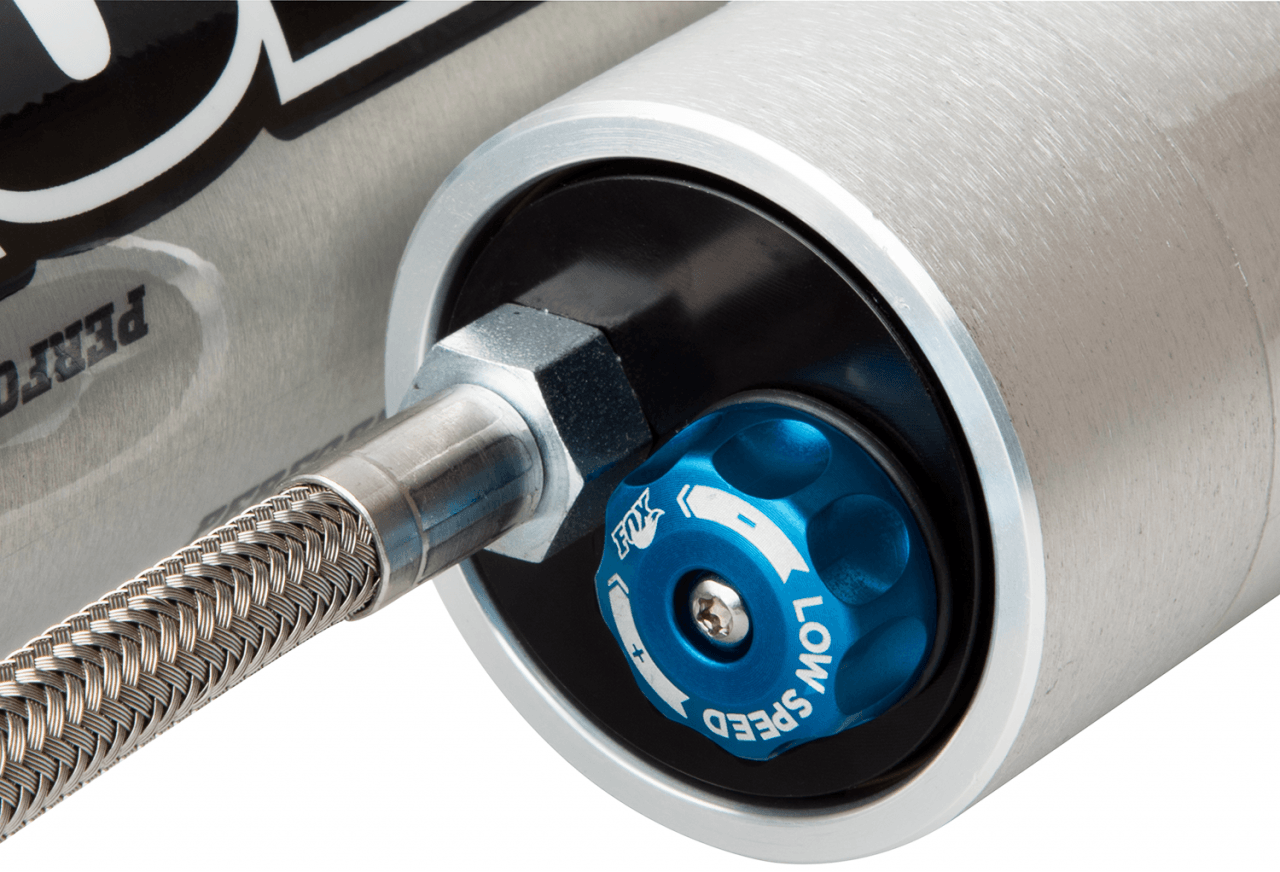 Fox Performance Series 2.0 Smooth Body Reservoir Shock - Adjustable - 985-26-016 close-up of blue speed control knob and braided stainless steel line