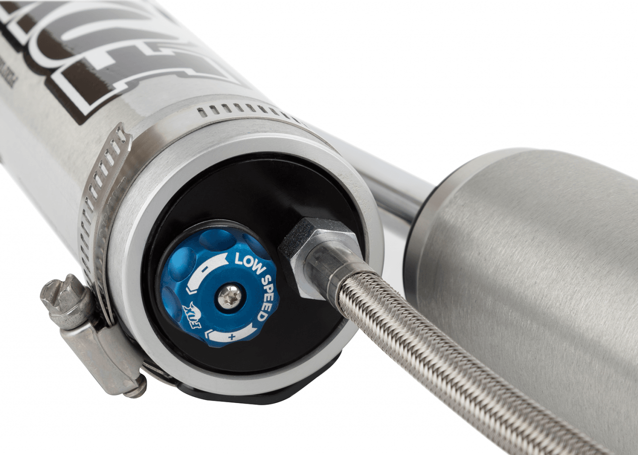 Fox Performance Series 2.0 Smooth Body Reservoir Shock - Adjustable - 985-26-133 close-up of low speed adjuster and braided stainless steel line